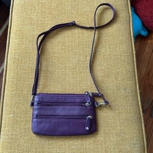 Soprano leather Eggplant purple wristlet with long strap.